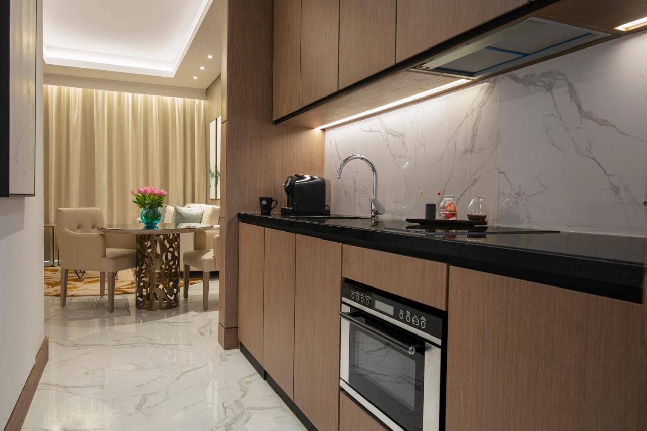 Al Jaddaf Rotana Suite Hotel Dubai Exterior photo A kitchen in a typical apartment