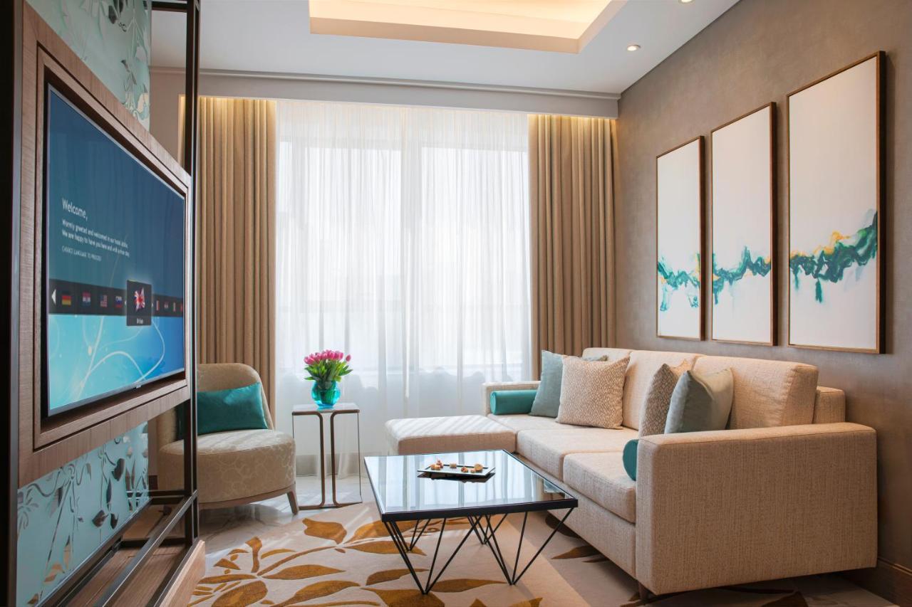 Al Jaddaf Rotana Suite Hotel Dubai Exterior photo A living room at the hotel