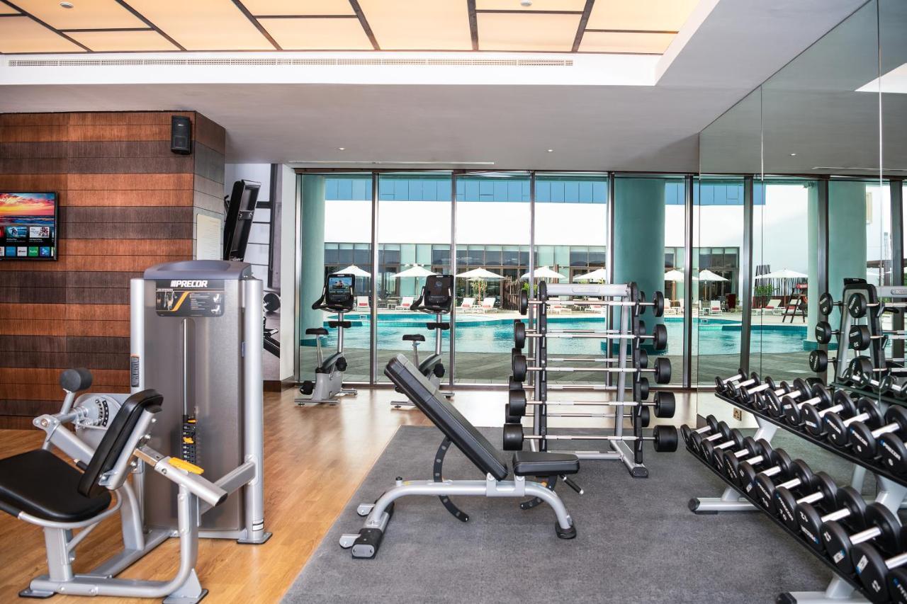 Al Jaddaf Rotana Suite Hotel Dubai Exterior photo The gym at the hotel